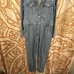 Here I have a top shop denim jumpsuit in. Mid-blue wash